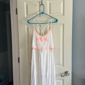 White maxi dress with neon orange embroidery detai